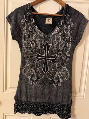 Vocal V-neck top w/ rhinestone and sequin cross, crocheted lace trim at the hem.